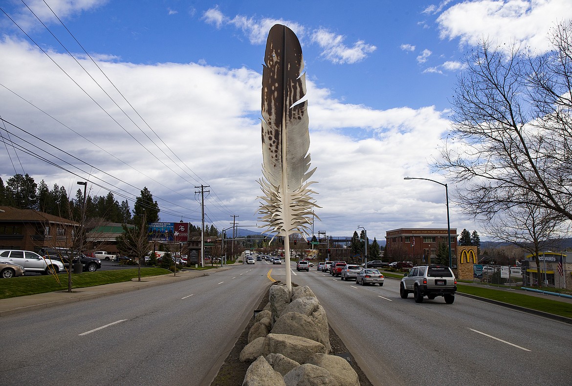 Northwest artists and friends David Govedare and Keith Powell designed and created the feathers for the public art display, titled &quot;Guardians of the Lake,&quot; that was installed in May 2002. The artists created two smaller models of the feathers that will be auctioned off Friday during the &quot;Fly Like An Eagle&quot; program at The Coeur d'Alene Resort. (LOREN BENOIT/Press)