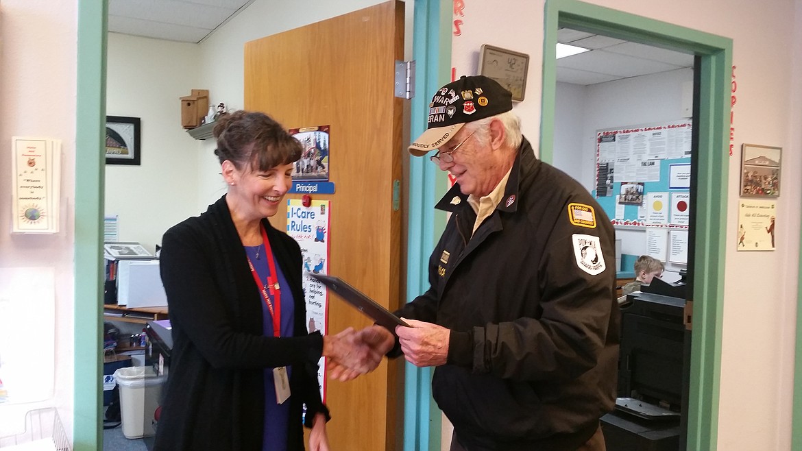 (Courtesy photo)
Idaho Hill Elementary Principal Susie Luckey, left, was awarded the American Legion Certificate of School Award by the Henry E. Bergdorf American Legion Post 155. The certificate says: &#147;This Certificate of Distinguished Achievement is awarded to Susie Luckey of Idaho Hill Elementary School in recognition of attainment acquired as winner of The American Legion School Award. In further recognition of the possession of those high qualities of courage, honor, leadership, patriotism, scholarship and service, which are necessary to the preservation and protection of the fundamental institutions of our government and the advancement of society.&#148; The award was presented to Luckey by Lester &#147;Bruce&#148; Taylor, post commander, right.