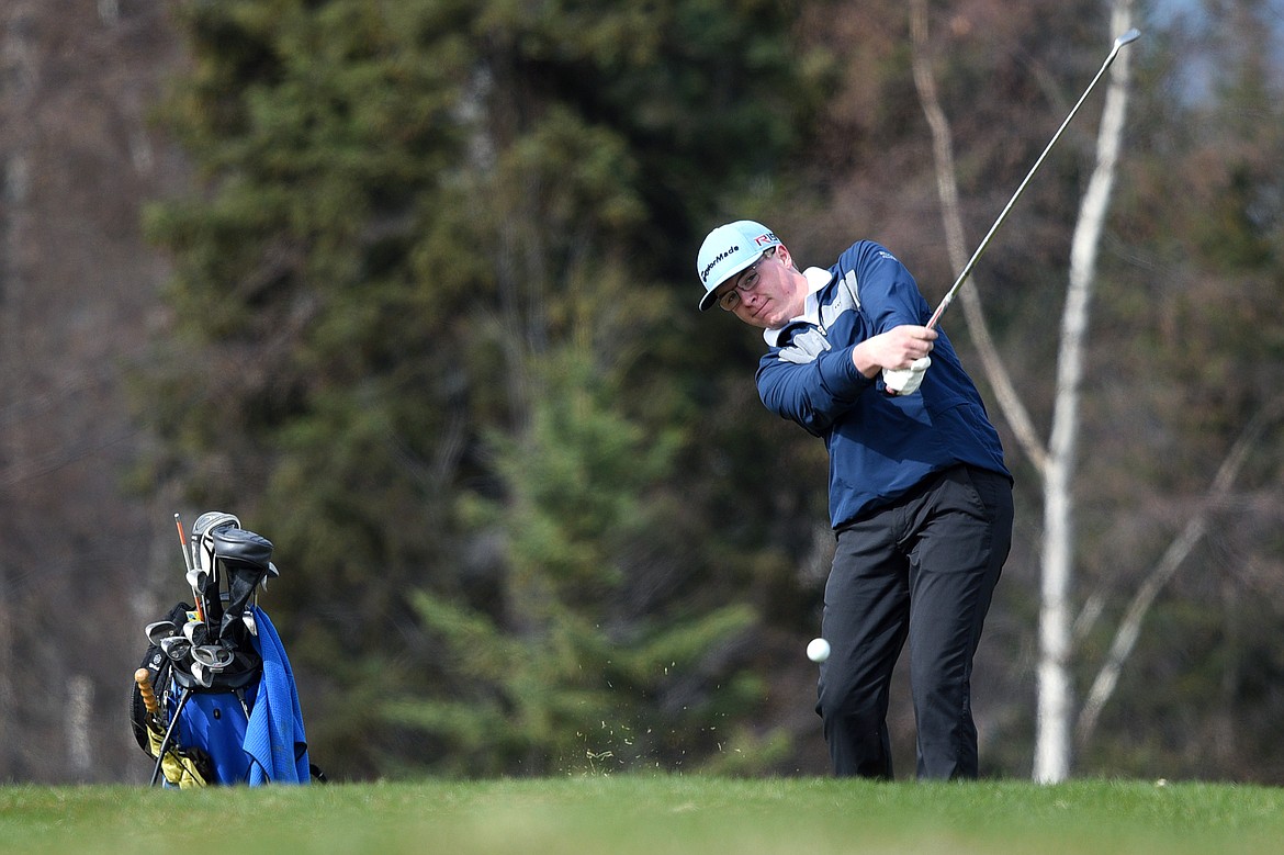 Bigfork&#146;s Augie Emslie hits his second shot on hole No. 2 at Eagle Bend Golf Club in Bigfork on Thursday. (Casey Kreider/Daily Inter Lake)