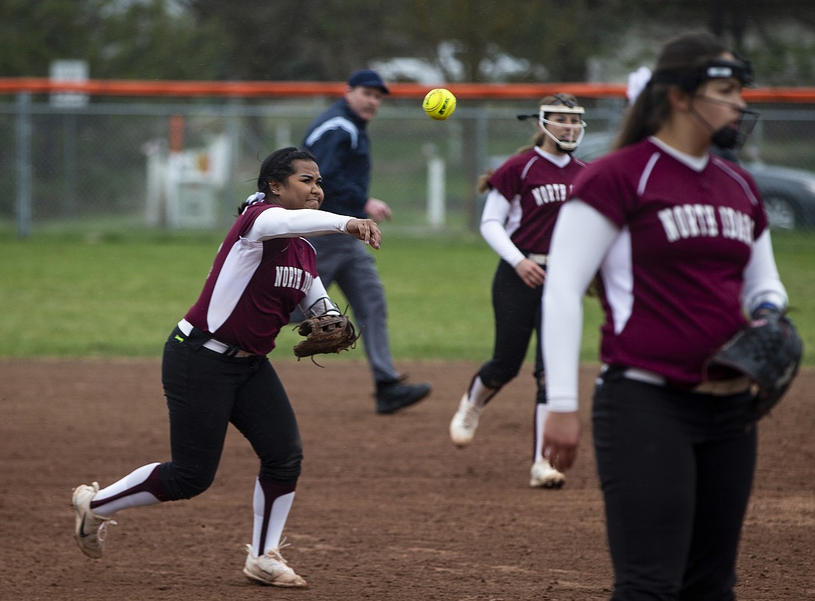North Idaho College third baseman Kalyna Korok throws to first for the out against Big Bend.