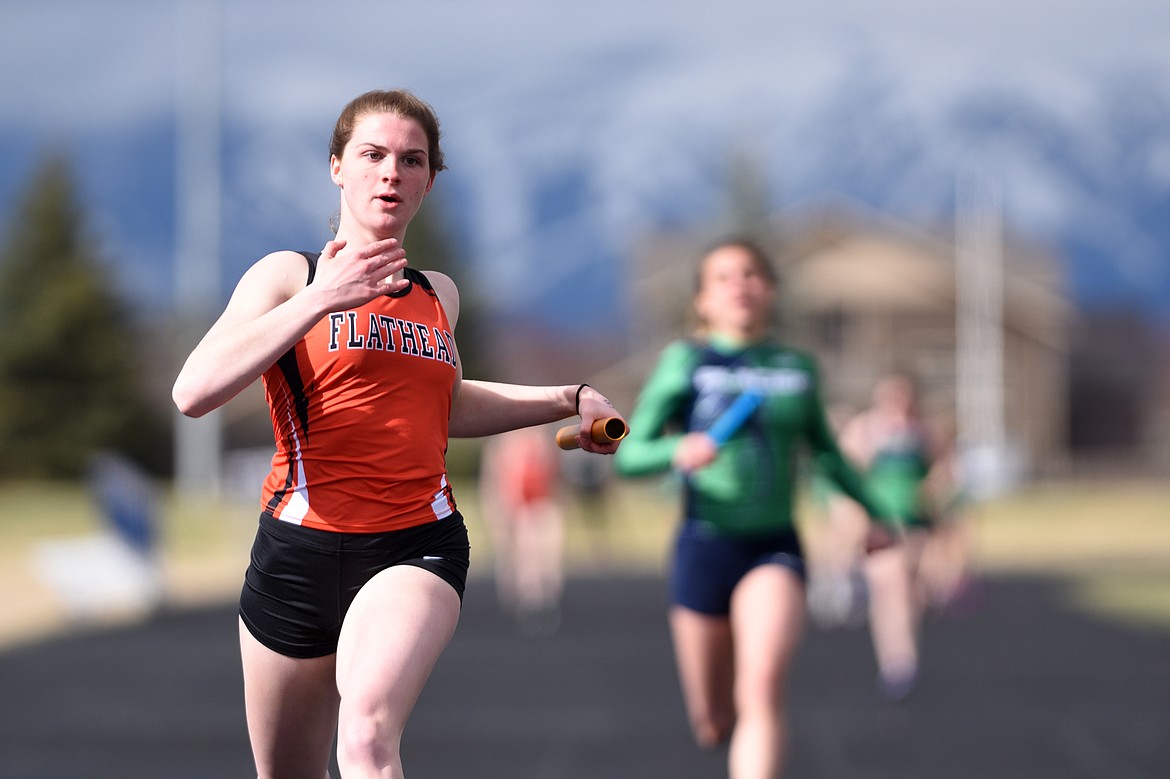 Flathead High School&#146;s Jessica Barnhart anchors the girls&#146; 4x100 meter relay team during a meet with Glacier at Glacier High School on Tuesday. (Casey Kreider/Daily Inter Lake)