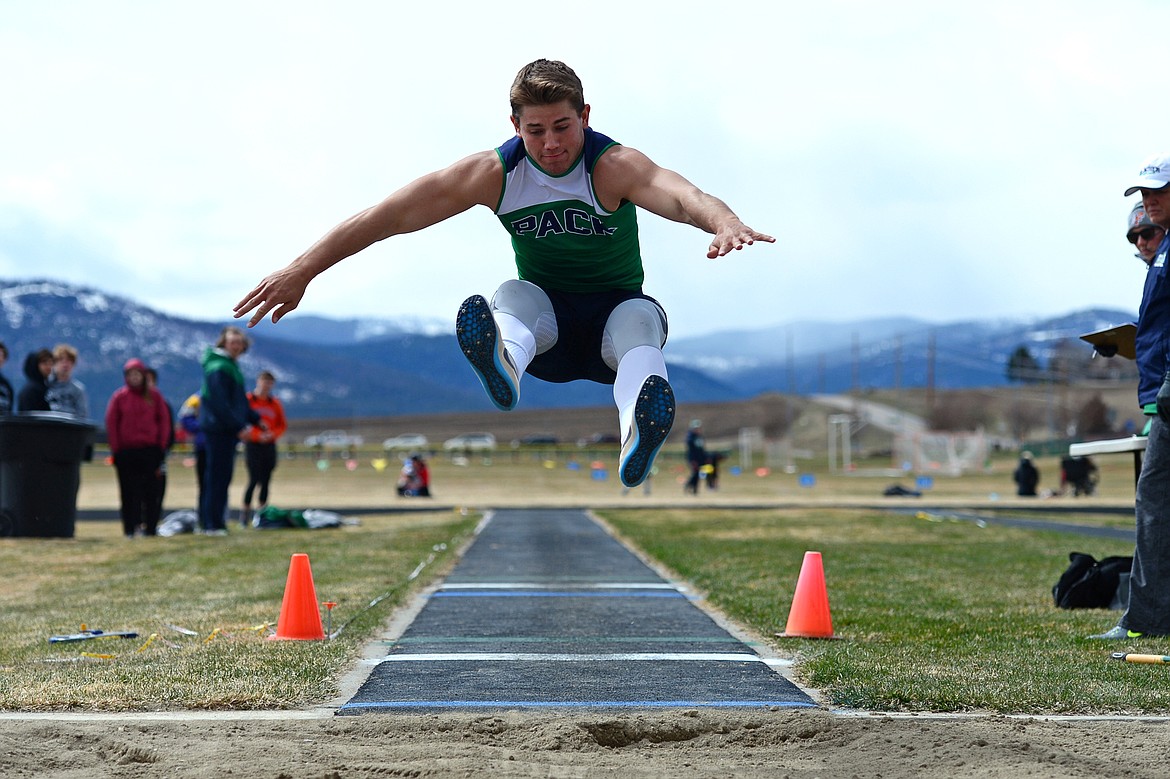 Glacier High School&#146;s Jackson Pepe competes in the long jump in a meet with Flathead at Glacier High School on Tuesday. (Casey Kreider/Daily Inter Lake)