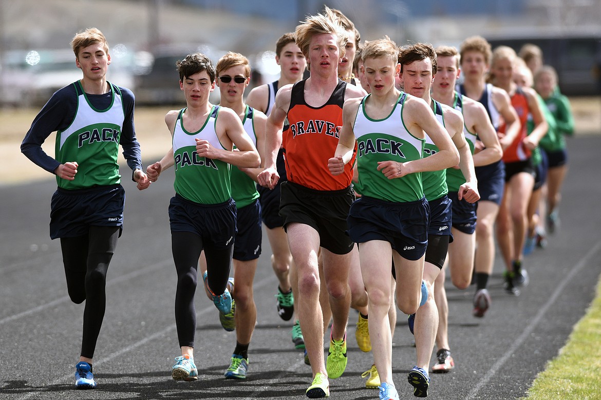 Glacier and Flathead boys compete in the 3,200 meter run during a meet at Glacier High School on Tuesday. (Casey Kreider/Daily Inter Lake)