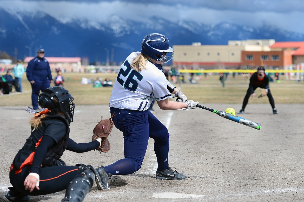 Glacier's Alivia Atlee drives in two runs in the bottom of the 4th inning against Flathead on Tuesday. (Casey Kreider/Daily Inter Lake)