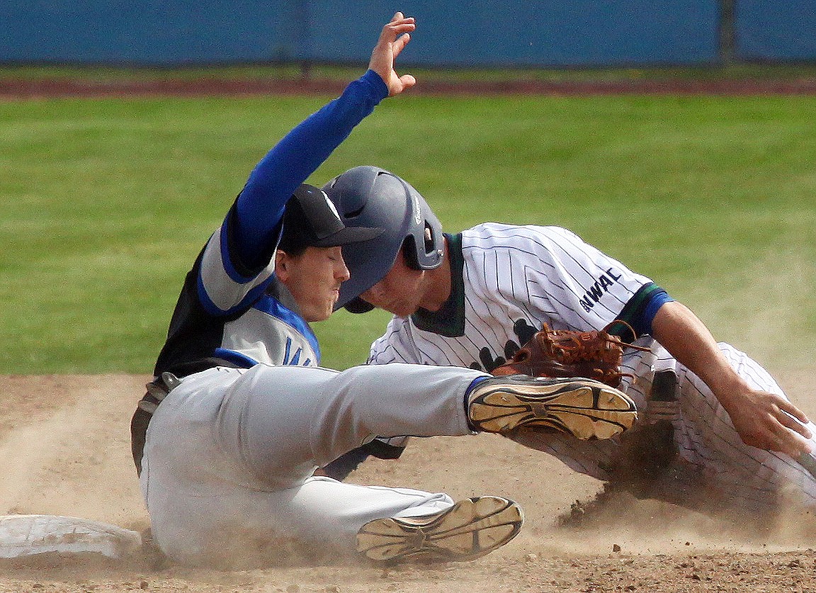 Rodney Harwood/Columbia Basin HeraldBig Bend base runner Daulton Kvenvold is tagged out trying to steal second by Blue Mountain shortstop TJ Rea during the first game of Tuesday's NWAC East doubleheader.