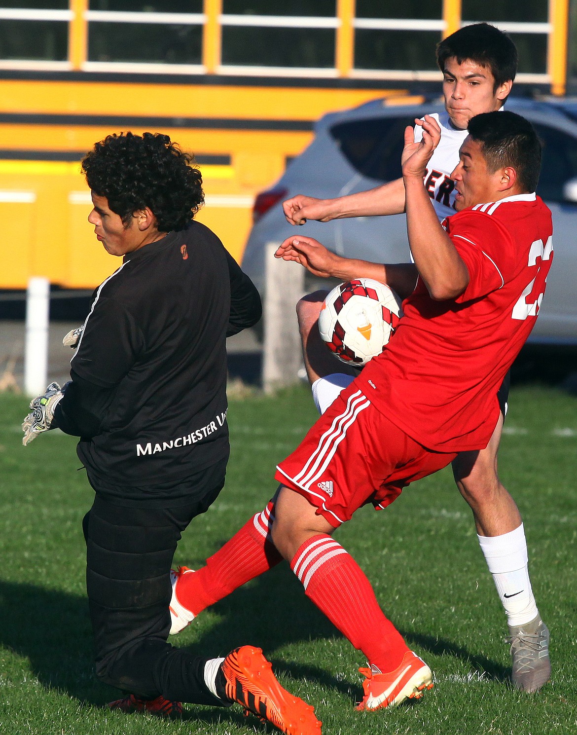 Rodney Harwood/Columbia Basin HeraldEphrata striker Juan Mendoza (5) takes a shot as the Prosser goaltender Jon Delgado and Nikolas Rodriguez (25) collapse on the defense during the first half of Tuesday's CWAC match.