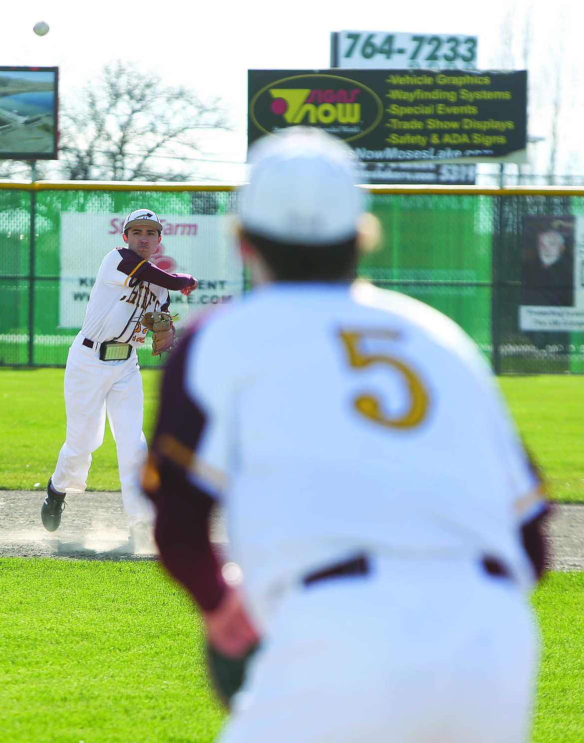 Connor Vanderweyst/Columbia Basin Herald
Moses Lake shortstop Cody Alvarado makes the throw to Dax Lindgren (5) at first base for an out.