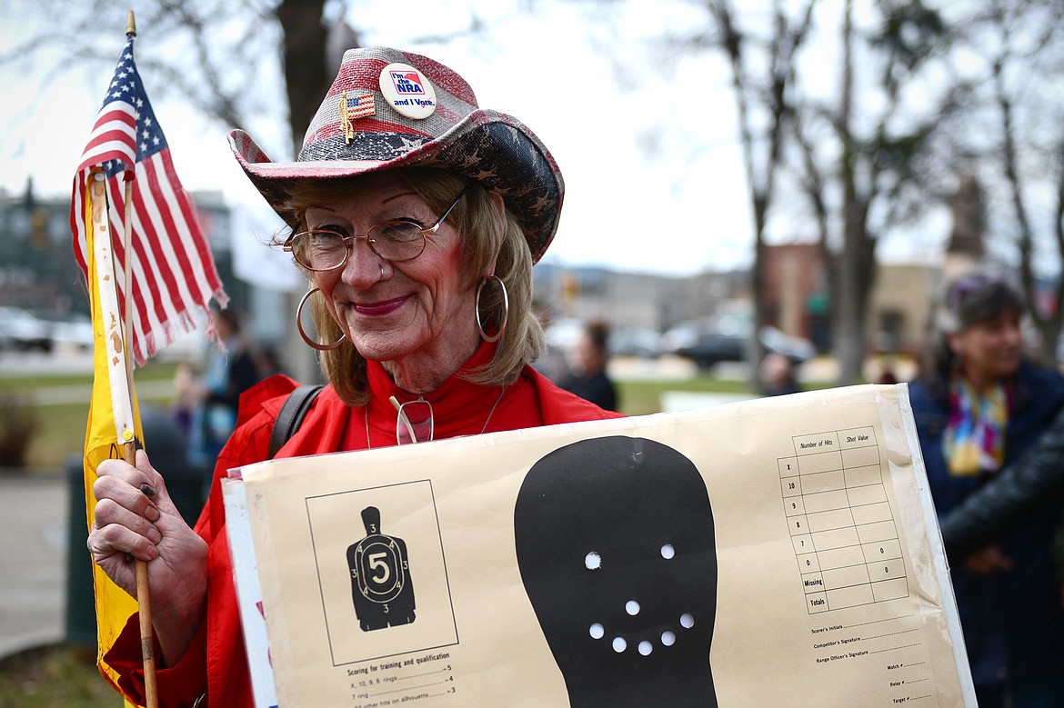 Tisch Haas, of Kalispell, listens to speakers at the &#147;Rally for our Rights&#148; pro-gun demonstration at Depot Park in Kalispell on Saturday. (Casey Kreider/Daily Inter Lake)