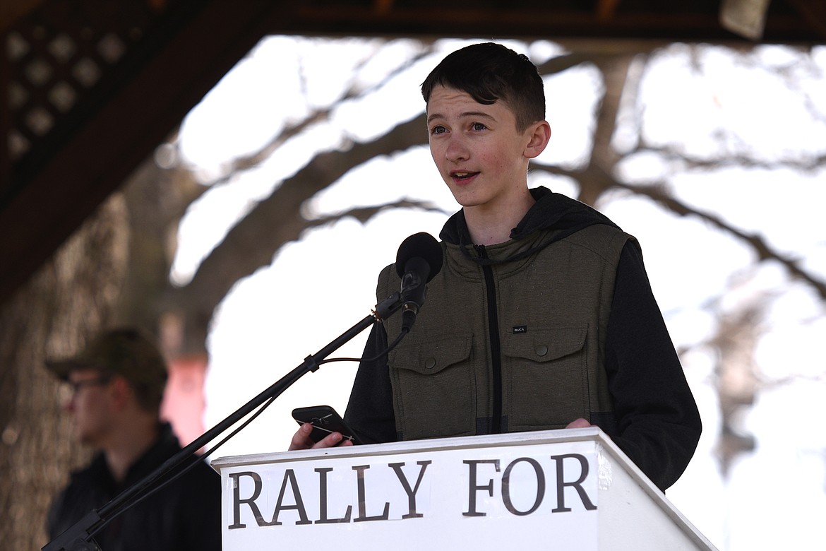 Bridger Gould, a sophomore at Columbia Falls High School, reads an essay he wrote for school during the &#147;Rally for Our Rights&#148; pro-gun demonstration at Depot Park in Kalispell on Saturday. (Casey Kreider photos/Daily Inter Lake)