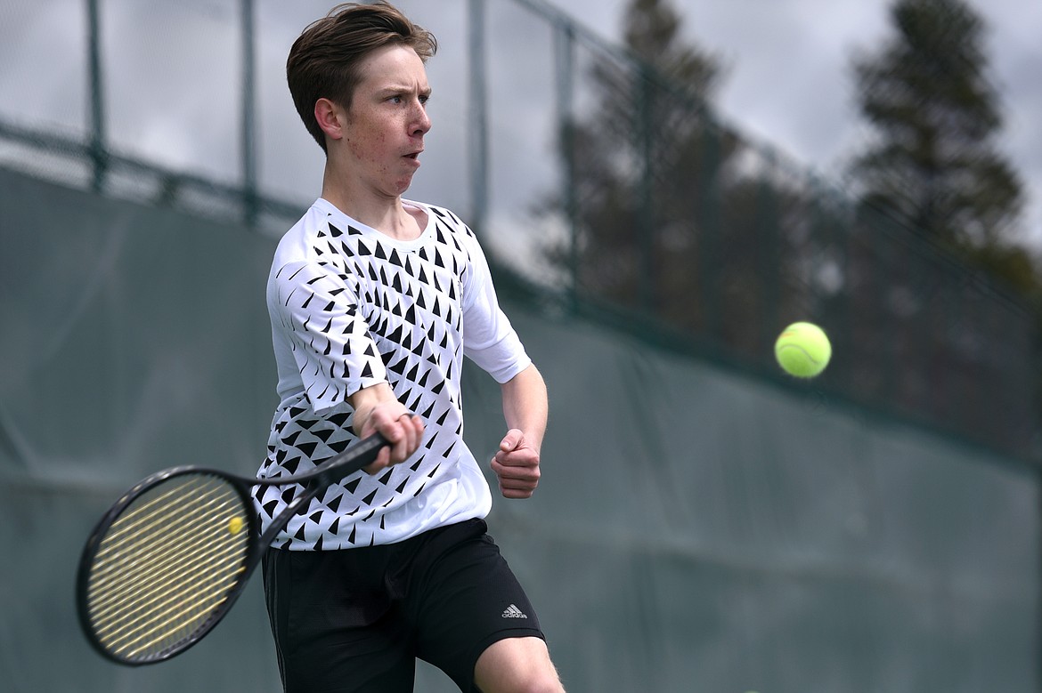 Flathead's Ethan Hawkins hits a return against Glacier's Rory Smith at Flathead Valley Community College on Friday. (Casey Kreider/Daily Inter Lake)