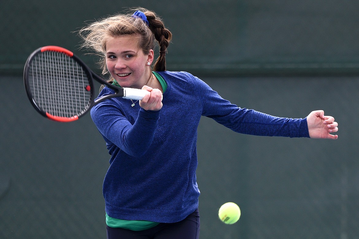 Glacier's Maria Frampton hits a return against Flathead's Delani Long at Flathead Valley Community College on Friday. (Casey Kreider/Daily Inter Lake)