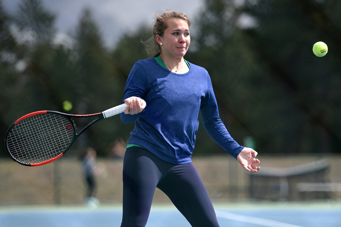 Glacier's Maria Frampton hits a return against Flathead's Delani Long at Flathead Valley Community College on Friday. (Casey Kreider/Daily Inter Lake)