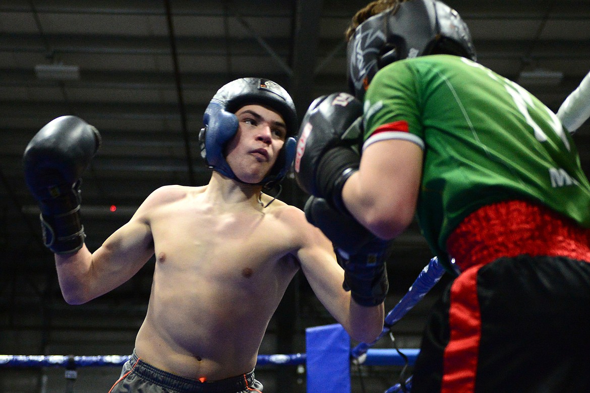 Glacier's Justin Gronley, left, and Columbia Falls' Kevin Maldonado square off at the 9th annual Crosstown Boxing Smoker at the Flathead County Fairgrounds on Thursday night. Gronley won the bout. (Casey Kreider/Daily Inter Lake)