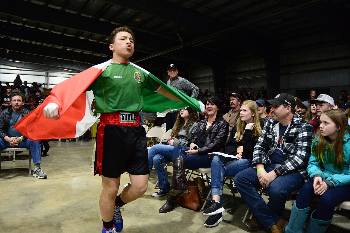 Columbia Falls High School's Kevin Maldonado walks to the ring for his bout with Glacier High School's Justin Gronley at the 9th annual Crosstown Boxing Smoker at the Flathead County Fairgrounds on Thursday night. Gronley won the bout. (Casey Kreider/Daily Inter Lake)