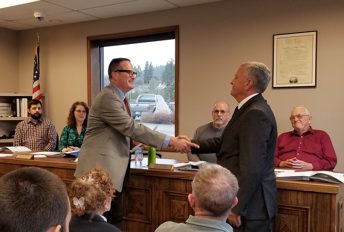 Photo by MANDI BATEMAN
On April 17, Brian Zimmerman, right, was sworn in as the new Bonners Ferry police chief by Bonners Ferry Mayor David Sims. The appointment follows the April 13 resignation of the former Chief of Police, Vic Watson. Zimmerman began his law enforcement career in Bonners Ferry in 1981. After being sworn in, he said to the city council and audience, &#147;It is good to be home.&#148; A profile of Zimmerman will appear in next week&#146;s Herald.