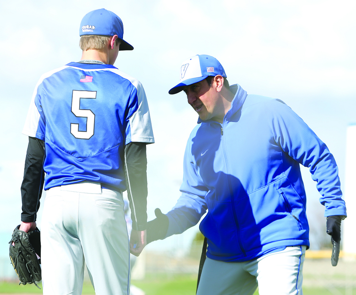 Connor Vanderweyst/Columbia Basin Herald
Warden head coach Dan Caballero gives instruction to Kaden Skone between innings against Cascade.