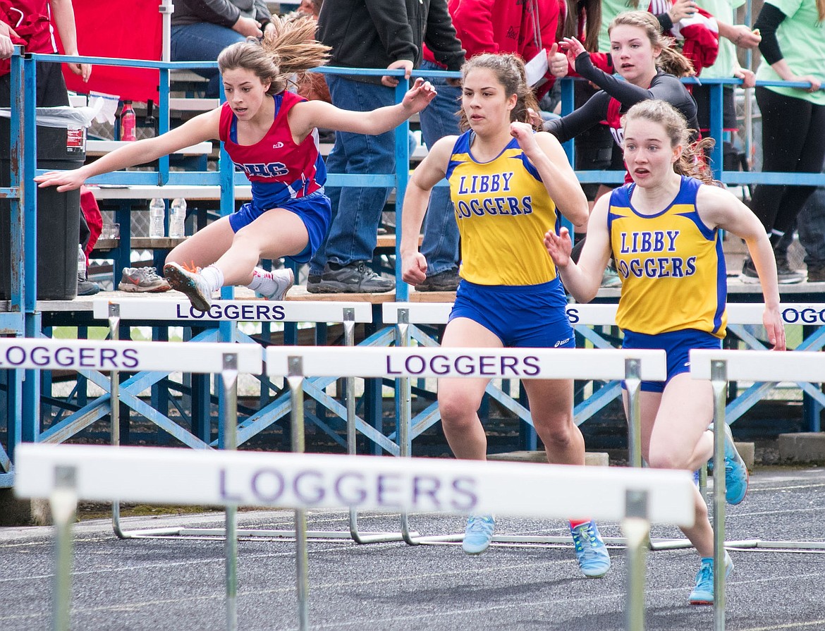 Libby junior Emma Gruber (right) took first place in the 100m hurdles, followed close by fellow junior Isabella Hollingsworth. (Ben Kibbey/The Western News)