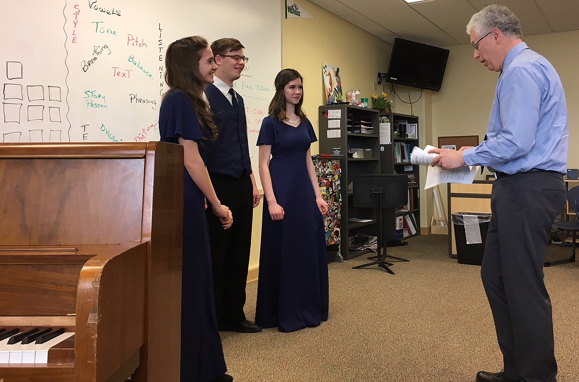 Trio Mikalyn Zeiler, left, Kaleb Lindgren and Sophie Lee work with adjudicator Larry Sheldon at Glacier High School in Kalispell on Saturday. (Courtesy photo)