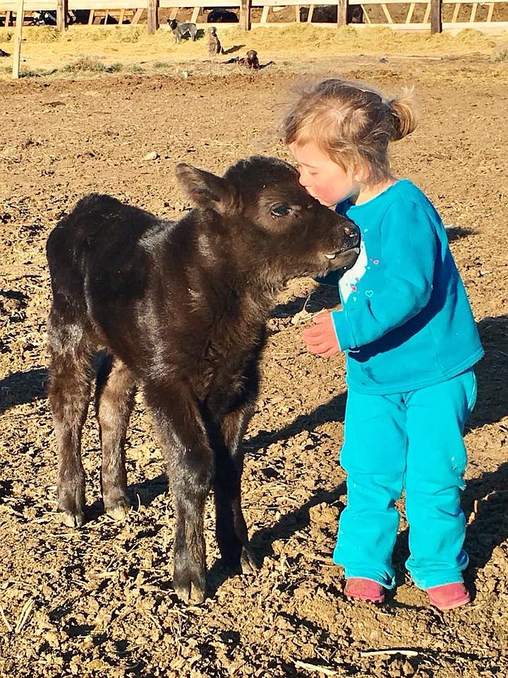 Next Mission Farms/courtesy photo
Kenzie Dormaier shares a moment with a hoofed friend at New Mission Farms.