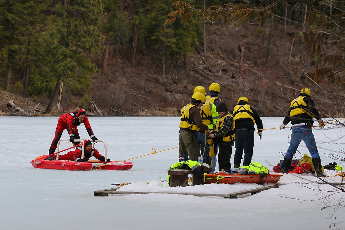 Photo by MANDI BATEMAN
Hall Mountain Firefighters practiced different techniques to rescue victims from the rotten ice.