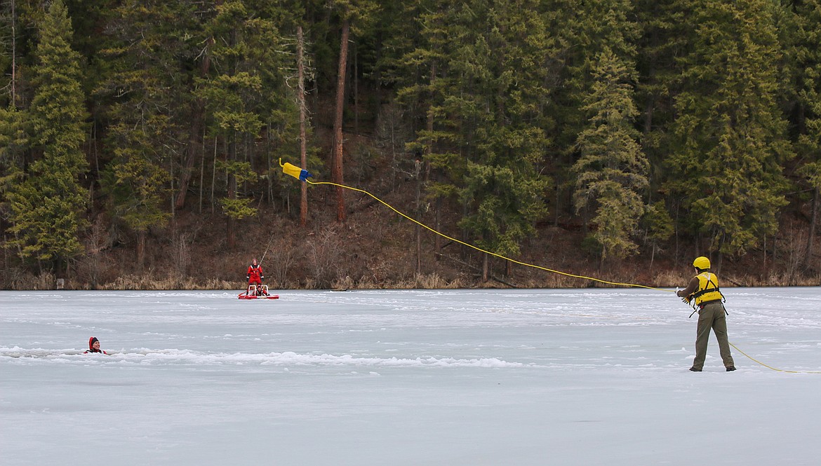 Photo by MANDI BATEMAN
Throwing a rope back to a mock victim in the ice of Robinson Lake.