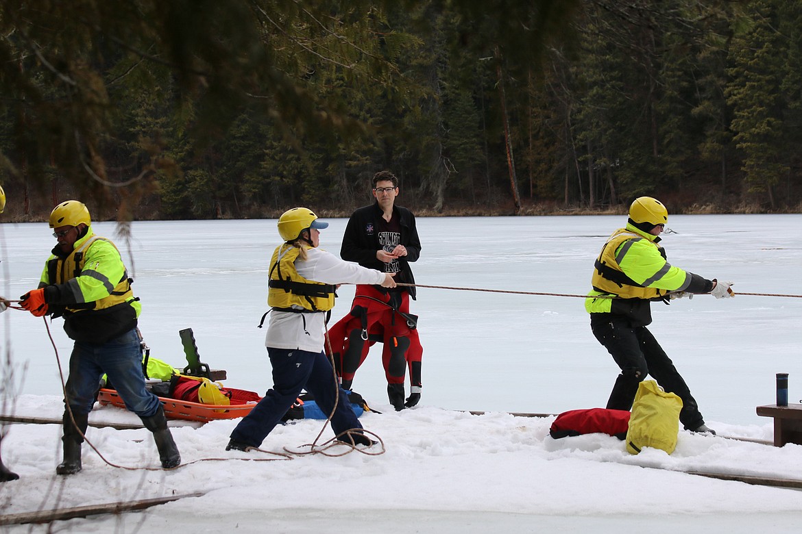 Photo by MANDI BATEMAN
The firefighters relied on teamwork to bring their mock victims to safety.