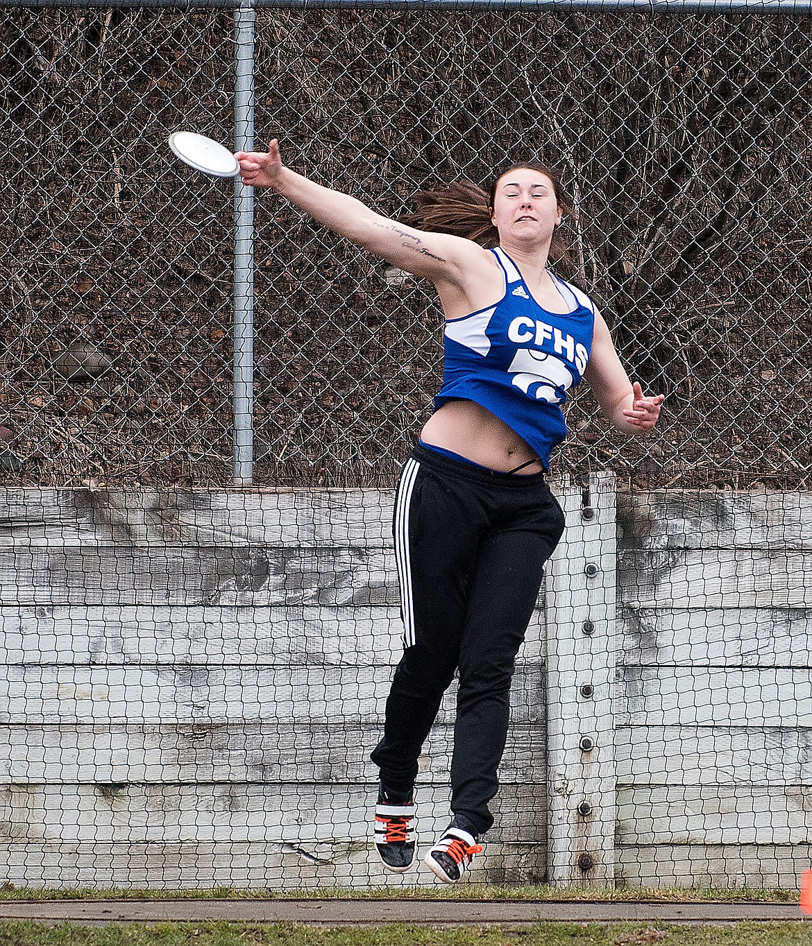 Tallia Sova competes in the discus Tuesday. (Chris Peterson photo)