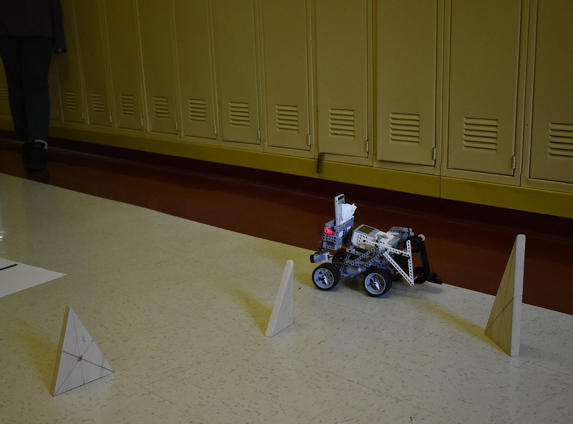 Piloted by MacKenzie Tallmadge, a robotic drone returns from the first successful navigation of an obstacle course at Troy High School, March 23. (Ben Kibbey/The Western News)
