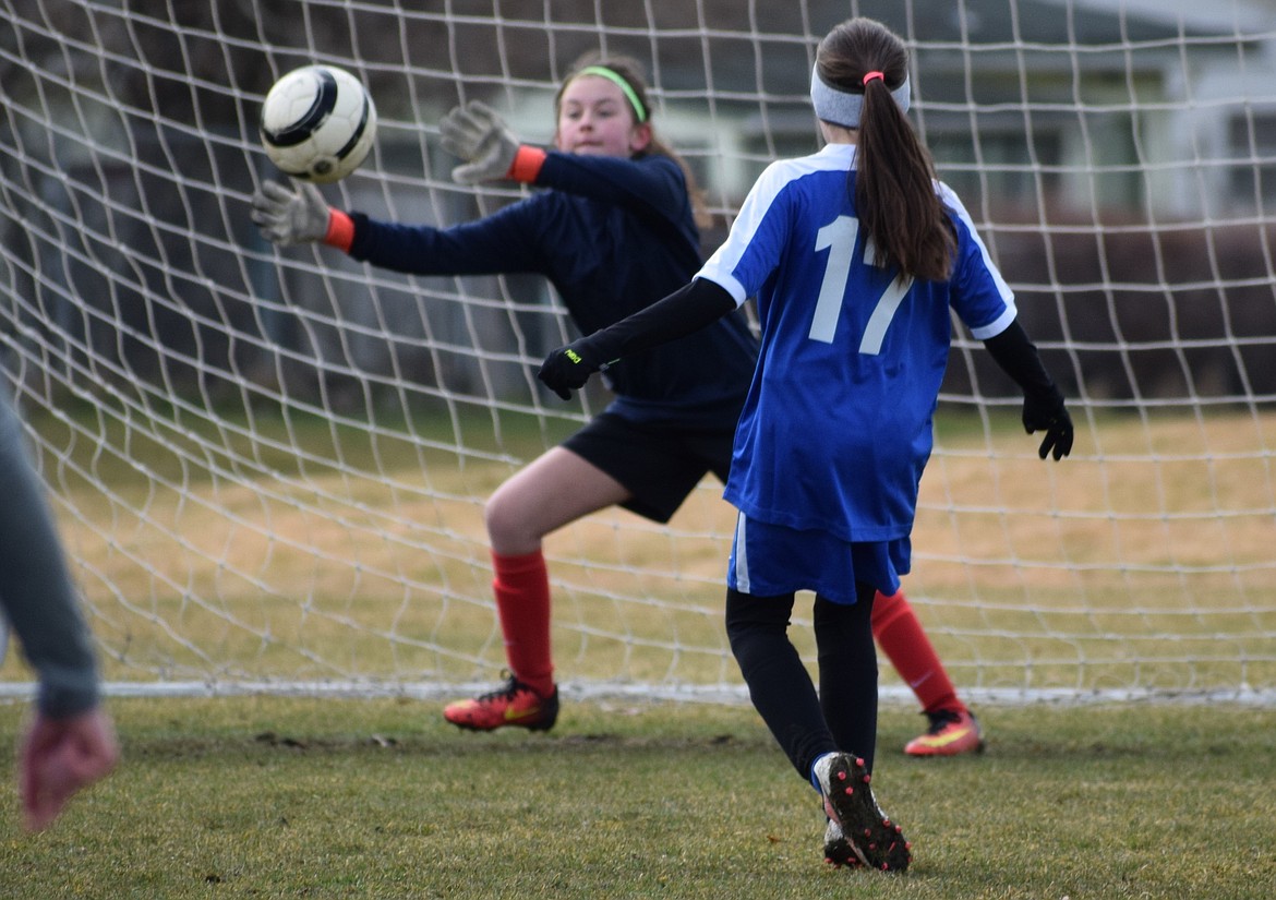 Courtesy photo
Riley Brazle of the North Idaho Inferno FC Hartzell &#146;06 girls shoots one just wide of the keeper to score against the IEYSA Breakers in a March 25 game.