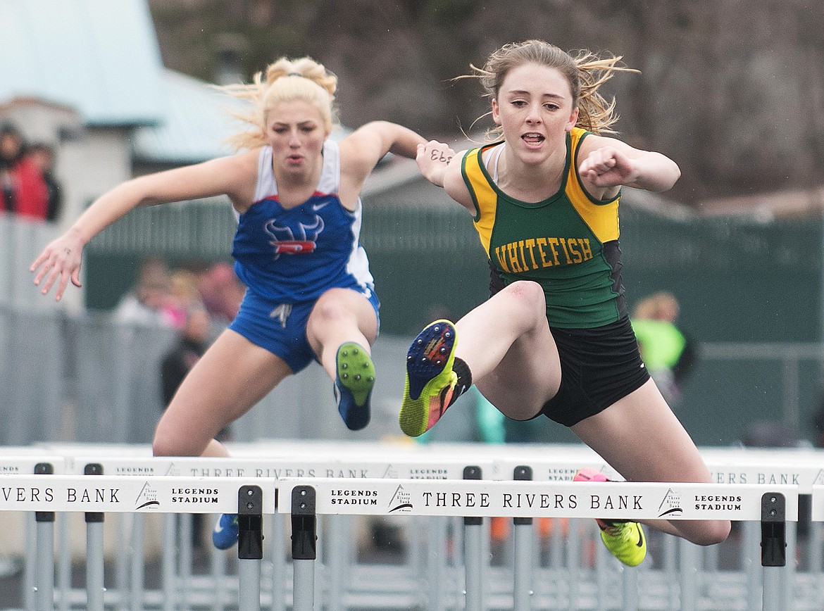 Kennedy Grove races ahead of a Bigfork hurdler last Tuesday at the Flathead Time Trials. (Chris Peterson/Hungry Horse News)