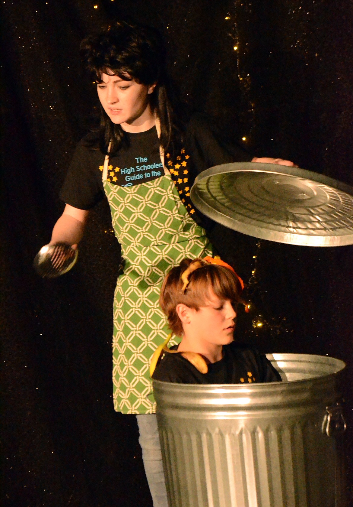 Plains High School student Rebecca Madden explains to the audience how to properly use a trash can, and that freshmen don&#146;t belong in them, at a recent production of &#147;High Schooler&#146;s Guide to the Galaxy.&#148; (Erin Jusseaume photos/ Clark Fork Valley Press)