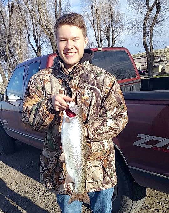 Pete Fisher photo - Michael Morrow with a nice Rainbow trout caught off the shore at MarDon Resort.