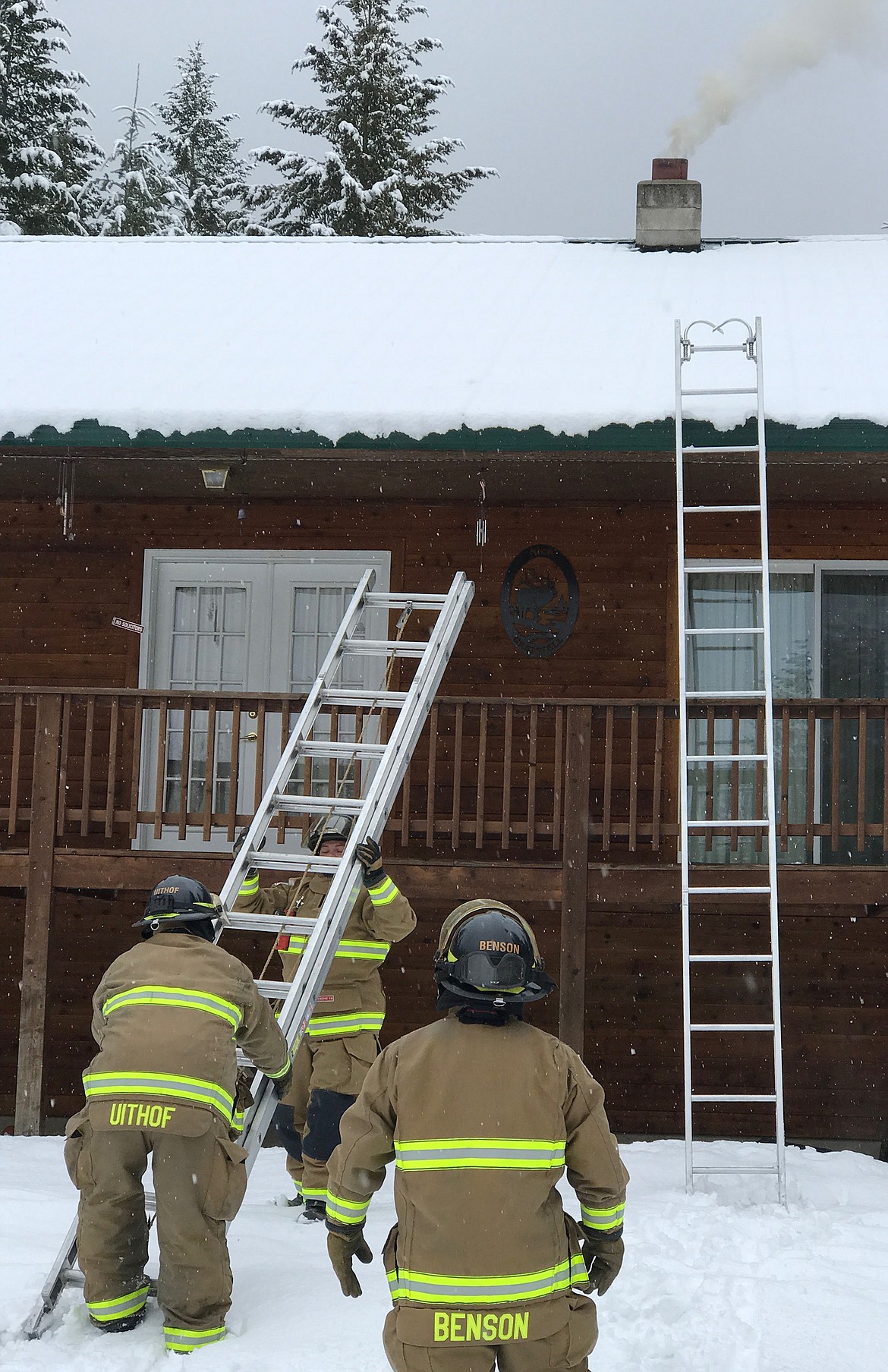 Libby volunteer firefighters respond to a chimney fire on Lodge Pole Way Saturday, April 7, 2018. (John Blodgett/The Western News)