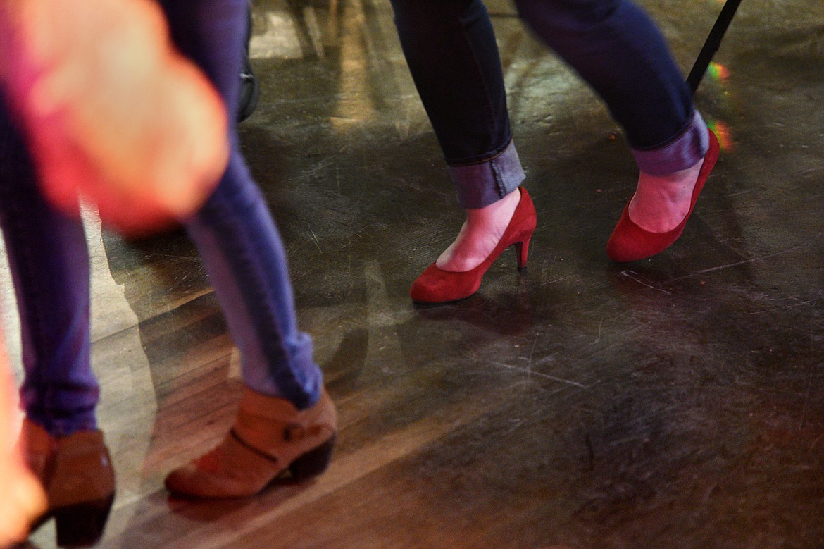 Participants learn dance steps.