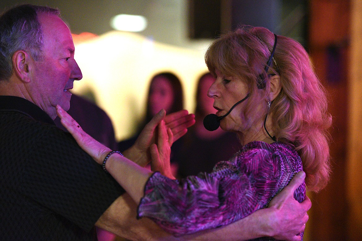 Dance teacher April Howard demonstrates a step with a participant at the Blue Moon Nite Club in Columbia Falls.