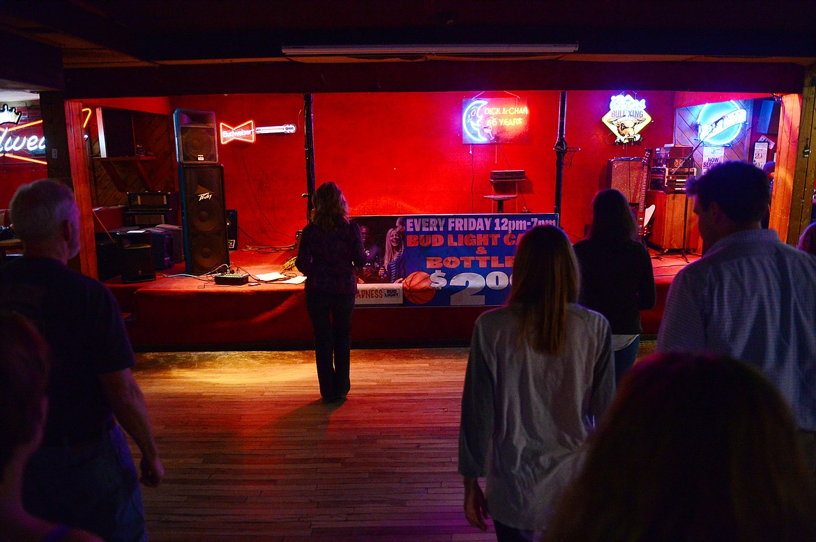 Dance teacher April Howard instructs particpants at the Blue Moon Nite Club in Columbia Falls on Wednesday, March 28. (Casey Kreider/Daily Inter Lake)