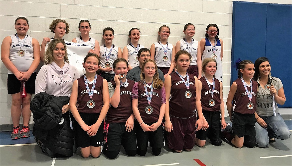 During the Superior Hoop Shoot the Clark Fork Mountain Cats girls teams won, with the 6th grade girls in first place (white uniforms) and 5th graders in second place (maroon uniforms). (Photo courtesy of Jeff Schultz)