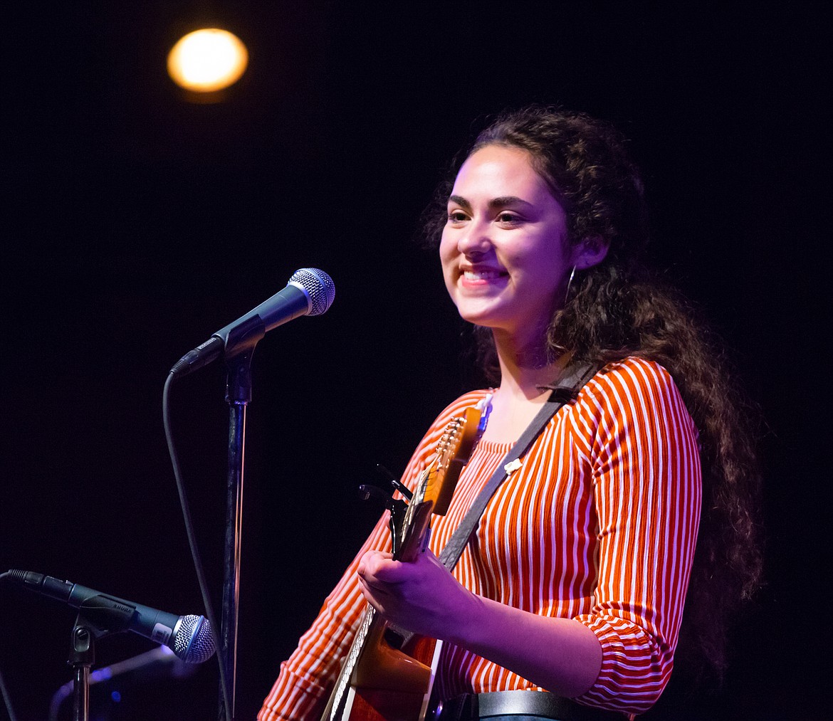 Maya Strauser smiles after performing an original song during the Whitefish Talent Show.