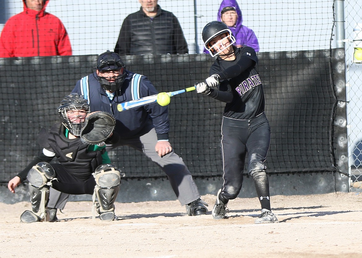 POLSON HIGH School player Josie Caye connects with a pitch in an early-season game against Belgrade at Polson High School's softball fields. The Lady Pirates hope to sustain its momentum as they enter the mid to late April schedule that features several top-tier teams in the conference and state. (photo courtesy of Bob Gunderson)