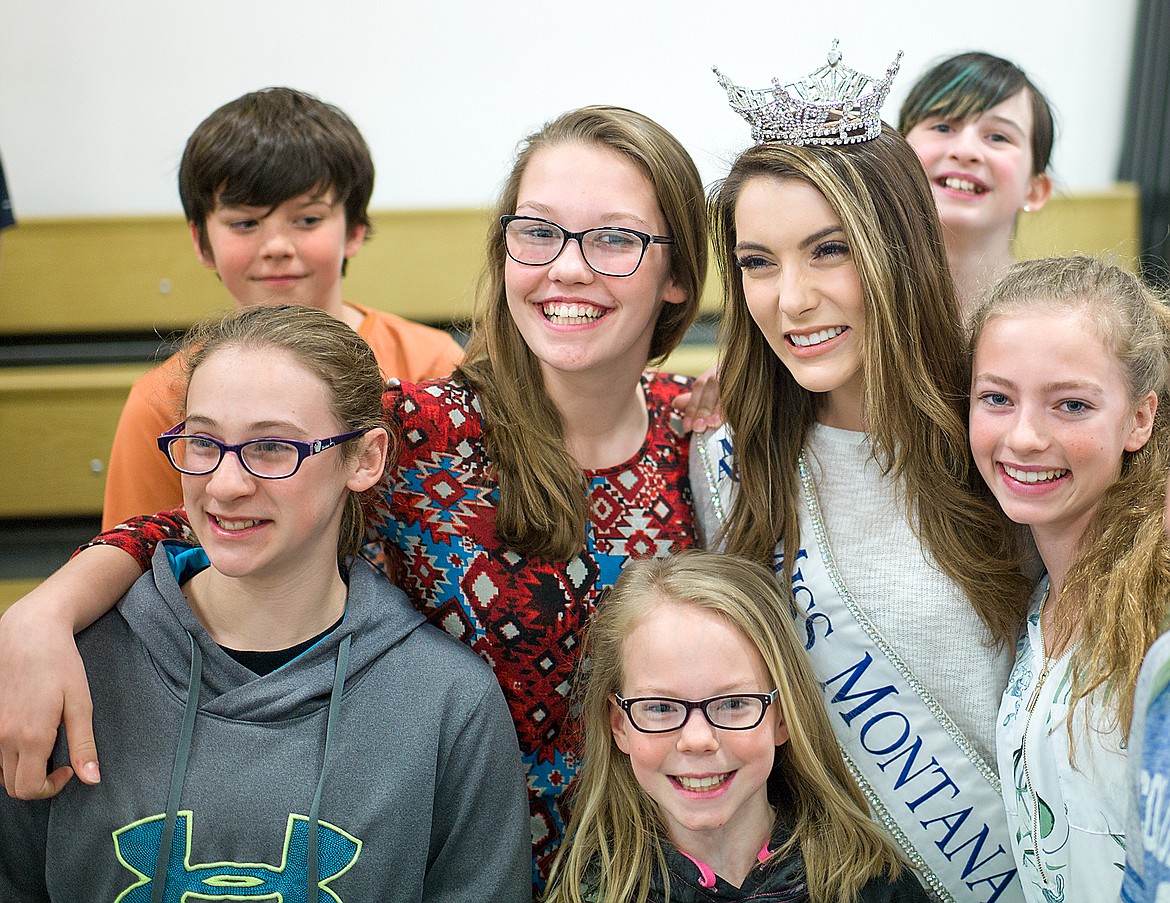 From left,  Jordyn Greene, Nevaeh Carlin, Courtney Hussion, Jadyn Haveman pose for as photo with Miss Montana Maddie Murray. In background are Christopher Carlin and Hailey Simon. (Chris Peterson photo)