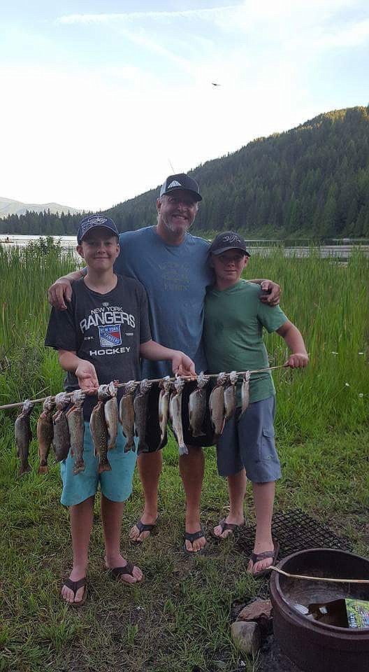 Photo courtesy of GLENN LEFEBVRE
Glenn Lefebvre of Sandpoint with nephews Parker Munson, Colton Onica and a string of trout from a Panhandle lake.