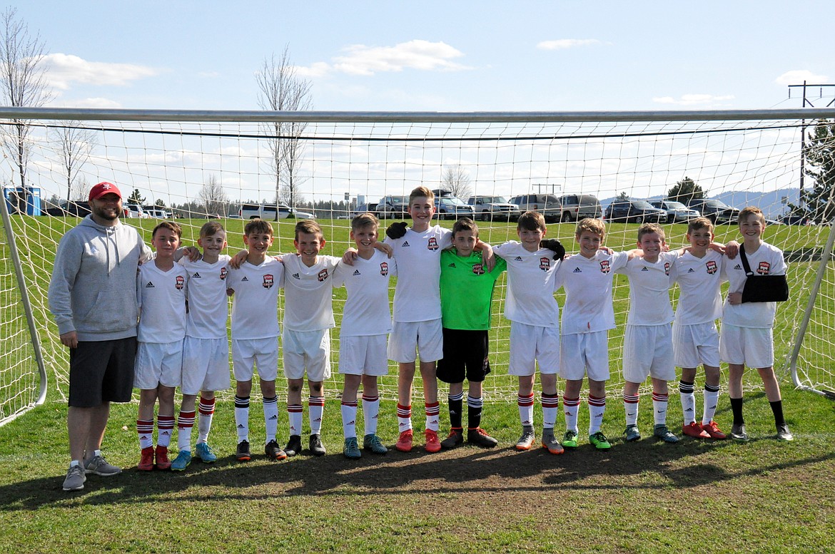 Courtesy photo
Last weekend, the Sting Timbers FC B06 Red advanced to the Washington Cup semifinals by going undefeated in the Washington Cup Qualifier at Plantes Ferry Soccer Complex in Spokane Valley. On Friday evening, the Sting beat FC Spokane B06 Escobar 3-1. Connor Jump and Haidyn Jonas each had 1 goal and 1 assist, and Kason Pintler added 1 goal for Sting. On Saturday, the Sting beat United SC Wenatchee 5-2. Haidyn Jonas led Sting with 2 goals. Connor Jump had 1 goal and 1 assist. Max Entzi and Max Cervi-Skinner each had 1 goal. Kason Pintler had 1 assist. 
On Sunday, the Sting beat Endeavor SC 7-1. Connor Jump led Sting with 3 goals. Kason Pintler had 2 goals. Haidyn Jonas and Max Entzi each had 1 goal. Ben Hannigan-Luther and Zack Cervi-Skinner each had 1 assist. The Sting finished the weekend by beating Leavenworth Storm 2-1.  Haidyn Jonas led Sting with 1 goal and 1 assist. Kason Pintler had 1 goal. Braden Latscha was in goal for all 4 matches.
The Sting will play Seattle Celtic White in the Washington Cup semifinal on Saturday evening in Lacey, Wash. From left are coach Matt Ruchti, Kason Pintler, Haidyn Jonas, Max Cervi-Skinner, Lachlan May, Aiden Rice, Max Entzi, Braden Latscha, Ben Hannigan-Luther, Connor Mongan, Connor Jump, Zack Cervi-Skinner and Jacob Molina.