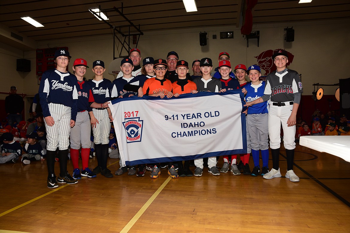 Courtesy photo
The 2017 11U Idaho state champions from Coeur d Alene Little League were recognized for their accomplishments in front of the entire league at the 2018 Opening Day for Coeur d'Alene Little League at Canfield Middle School on April 7. In the front row from left are Zane Blattstien, Cooper Erickson, Brady Hicks, Braeden Newby, Zeb Blattstien, Cooper Smith, Jake Dannenberg, AJ Currie, Avrey Cherry, Kyle Seman, Caden Symons and Austin DeBour; and back row from left, manager Sean Cheery, coach Jeff Smith, coach Manny Azevedo and coach Tony Seman. Not pictured is Sawyer Wilson.