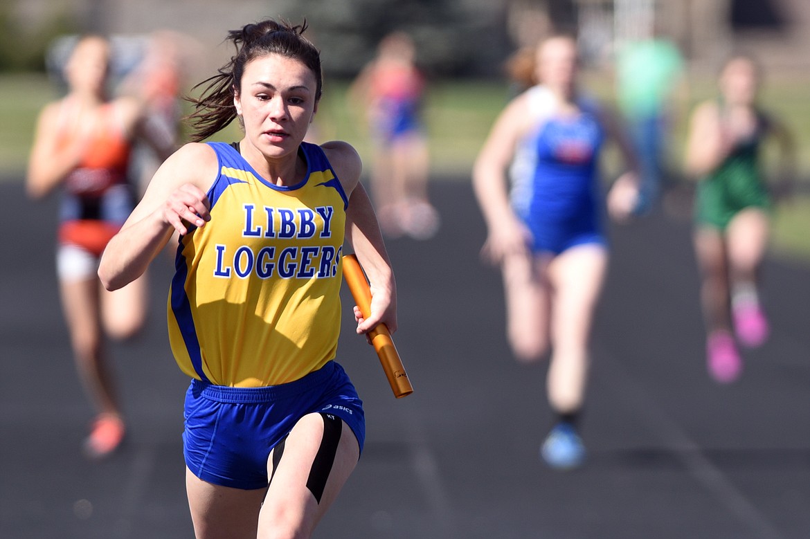 Libby&#146;s Sidney Stevenson crosses the finish line in the girls 400 meter relay at the Glacier Cinco track meet at Glacier High School on Thursday. Stevenson and teammates Isabella Hollingsworth, Emily Mossburg and Olivia Smith took first place in the 400 relay. (Casey Kreider/Daily Inter Lake)