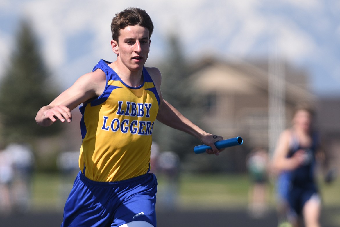 Libby&#146;s Brian Peck crosses the finish line in the boys 400 meter relay at the Glacier Cinco track meet at Glacier High School on Thursday. Peck and teammates Gavin Strom, Jay Beagle and Logan Christensen took first in the 400 relay. (Casey Kreider/Daily Inter Lake)