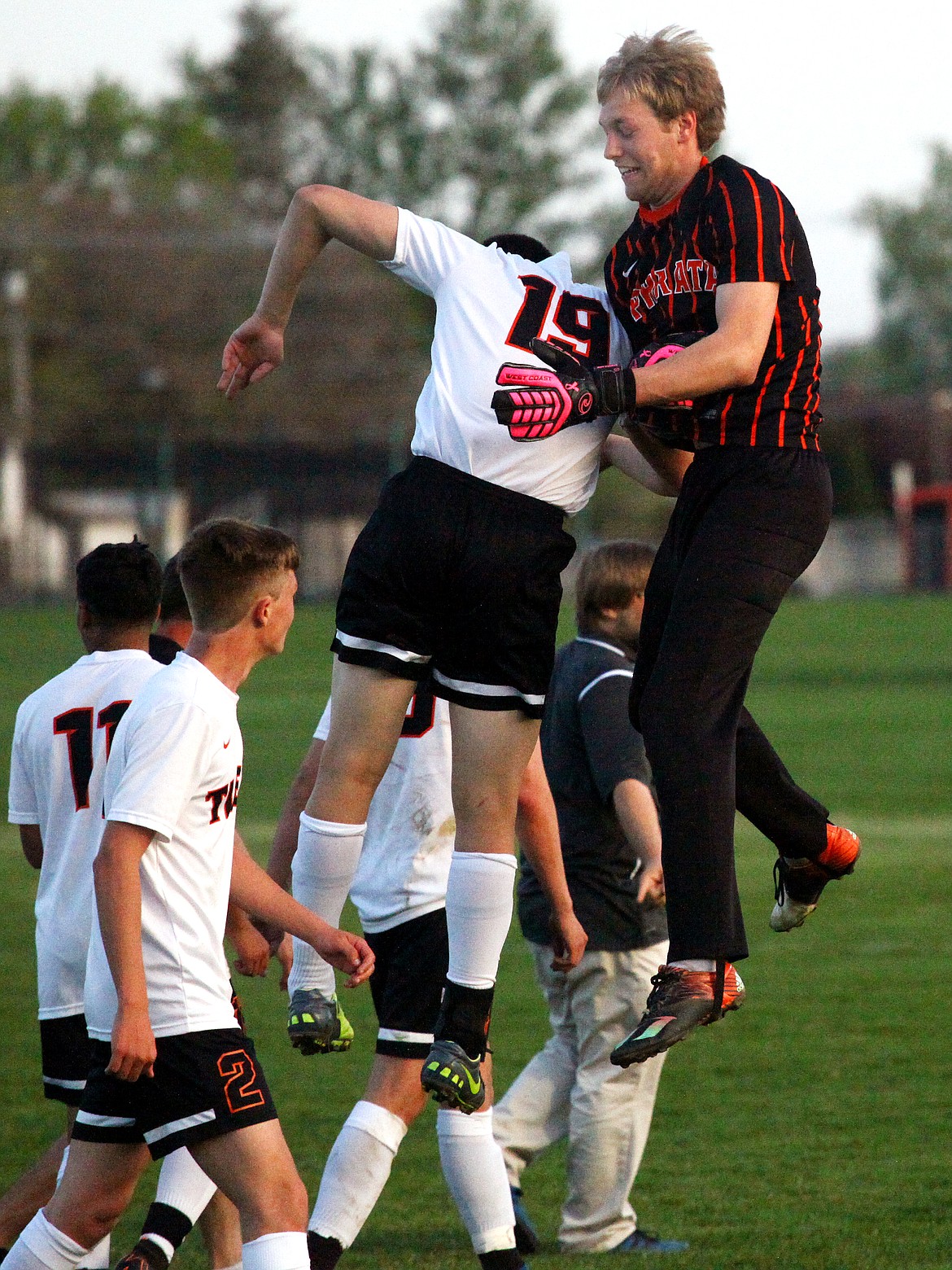 Rodney Harwood/Columbia Basin Herald
Ephrata goalkeeper Joshua Benthem, right, and Alan Maceda (19) enjoy a chest bump after the Tigers secured the final CWAC district tournment berth with a 1-0 victory over Othello.