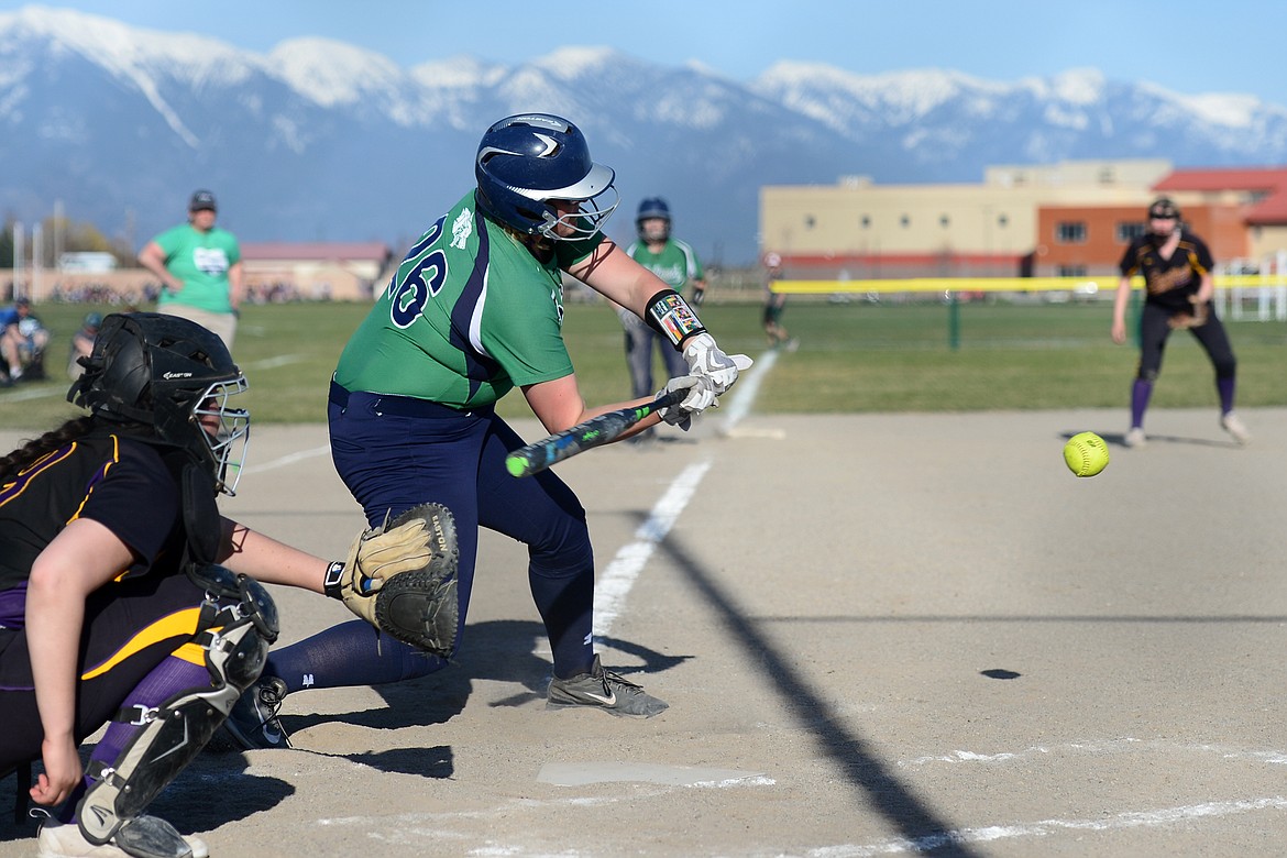 Glacier&#146;s Alivia Atlee drives in teammate Addie Labrum on a third-inning base hit against Missoula Big Sky on Thursday. (Casey Kreider/Daily Inter Lake)