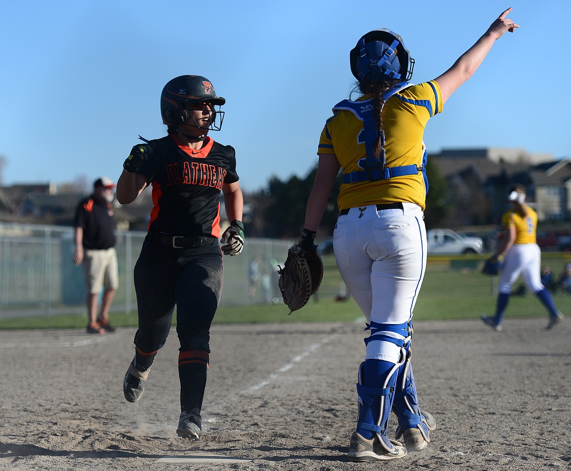 Flathead's Jayden Russell scores on a single by Riley Chouinard against Libby on Tuesday. (Casey Kreider/Daily Inter Lake)