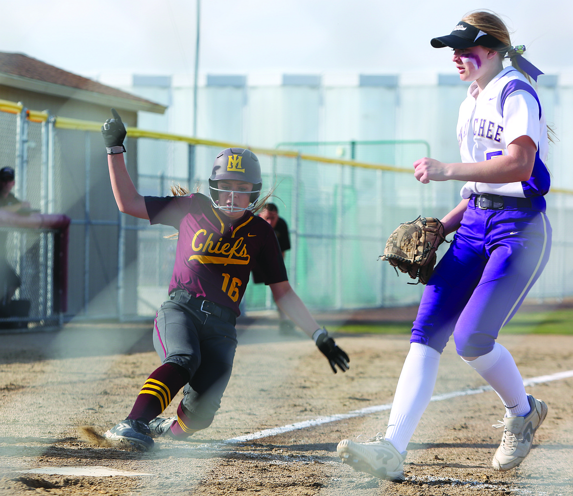 Connor Vanderweyst/Columbia Basin Herald
Moses Lake's Savannah Ashley (16) slides into home safely against Wenatchee.