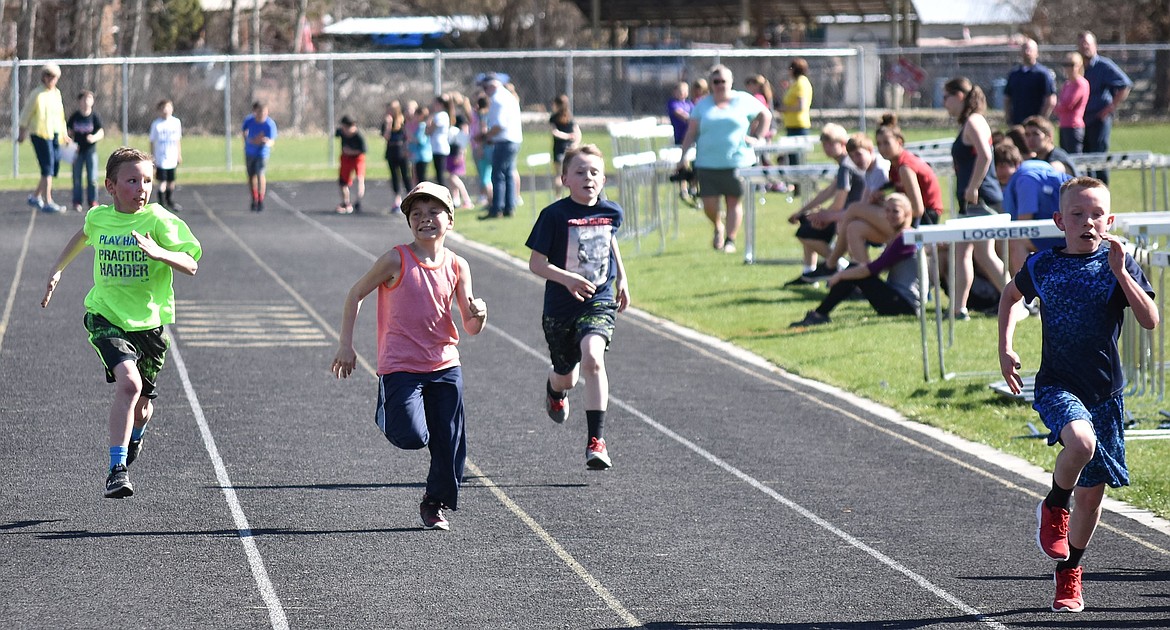 Libby Elementary School fourth graders Kale Hall, Caden Galligan, Tristen Eggers and Carter Benjamin compete in the 100m dash during the 4th-5th Grade Mini Track Meet held at Logger Stadium April 24. (Ben Kibbey/The Western News)